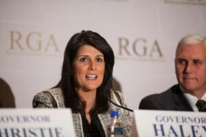 FILE PHOTO - Governor Nikki Haley (R-SC) answers a question next to Governor Mike Pence (R-IN) (R) during a news briefing at the 2013 Republican Governors Association conference in Scottsdale, Arizona November 21, 2013. REUTERS/Samantha Sais/File Photo