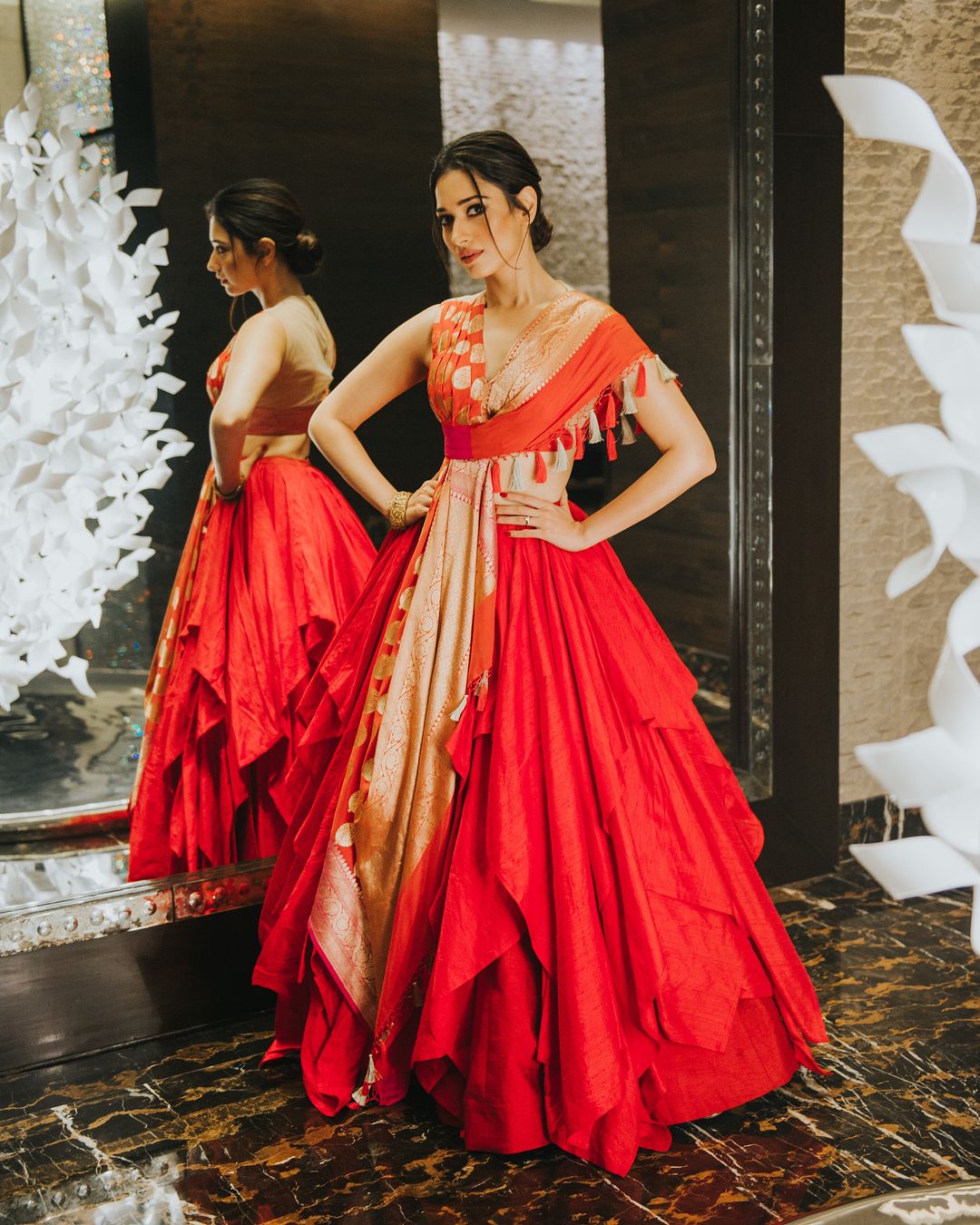 Tamannah is looking hot in red with A line multi-layered lehenga